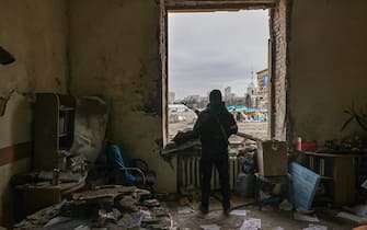 epa09794048 A member of the Territorial Defense Forces of Ukraine stands inside the damaged Kharkiv regional administration building in the aftermath of a shelling in downtown Kharkiv, Ukraine, 01 March 2022. Russian troops entered Ukraine on 24 February prompting the country's president to declare martial law and triggering a series of announcements by Western countries to impose severe economic sanctions on Russia.  EPA/SERGEY KOZLOV