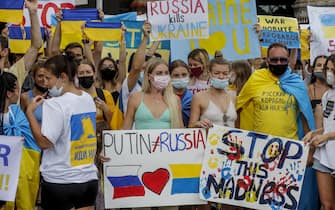 BALI, INDONESIA - MARCH 01: Ukrainians and other foreign citizens hold banners during a rally to protest against Russian attack on Ukraine, in Bali, Indonesia on March 1, 2022. (Photo by Johannes P. Christo/Anadolu Agency via Getty Images)