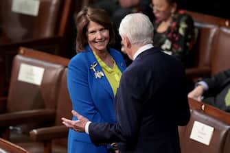 epa09794970 Rep. Cheri Bustos (D-IL) wears the colors of Ukraine's flag as she speaks with House Majority Leader Steny Hoyer (D-MD) as they wait for the State of the Union address during a joint session of Congress in the US Capitol's House Chamber, in Washington, DC, USA, 01 March 2022. EPA / Win McNamee / POOL