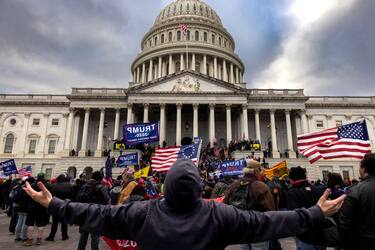 WASHINGTON, DC - JANUARY 6: Pro-Trump protesters gather in front of the U.S. Capitol Building on January 6, 2021 in Washington, DC. Trump supporters gathered in the nation's capital to protest the ratification of President-elect Joe Biden's Electoral College victory over President Trump in the 2020 election. A pro-Trump mob later stormed the Capitol, breaking windows and clashing with police officers. Five people died as a result.  (Photo by Brent Stirton/Getty Images)