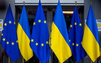 BRUSSELS, BELGIUM - MARCH 01: Flags of the European Union and Ukraine are seen at the entrance of the European Parliament during a demonstration in front of the European Parliament on March 01, 2022 in Brussels, Belgium. Hundreds of people gathered in front of the European Parliament to show their support for the Ukrainian people, including dozens of Ukrainians living in Belgium. The President of the European Parliament, Roberta Metsola, accompanied by MEPs gave a speech to those present in which she made clear the European Union's support for Ukraine and welcomed Ukraine's application for EU membership. On February 24, 2022 Russia began a large-scale attack on Ukraine, with explosions reported in multiple cities and far outside the restive eastern regions held by Russian-backed rebels. (Photo by Omar Havana/Getty Images)