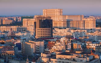 Romania, Bucharest, Palace of Parliament, world's second-largest building, elevated view, dawn