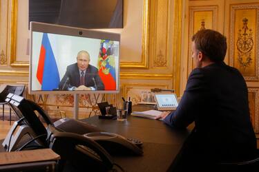 French President Emmanuel Macron listens to Russian President Vladimir Putin during a video at the Elysee Palace in Paris, France, 26 June 2020. ANSA/Michel Euler / POOL  MAXPPP OUT
