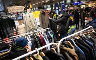 04 March 2022, Berlin: Ukrainian refugees pick out donated clothes at the main train station. Photo: Fabian Sommer/dpa (Photo by Fabian Sommer/picture alliance via Getty Images)