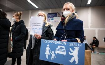 04 March 2022, Berlin: Two women offer at the main station for refugees Ukrainians a place to stay in Berlin. Photo: Fabian Sommer/dpa (Photo by Fabian Sommer/picture alliance via Getty Images)