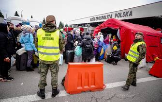 04 March 2022, Poland, Korczowa: Refugees wait at the Ukrainian-Polish border to enter Poland at the Korczowa border crossing. Numerous people arrive here every day, fleeing the war in Ukraine. Photo: Kay Nietfeld/dpa (Photo by Kay Nietfeld/picture alliance via Getty Images)
