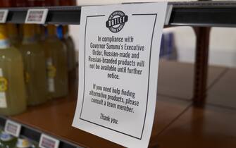 A sign notifies customers of New Hampshire Governor Chris Sununu's ban on selling Russian liquor at a store in Nashua, New Hampshire, US, on Tuesday, March 1, 2022. An international boycott of Russian vodka is building from the US to Australia as politicians and corporations signal their opposition to President Vladimir Putin's invasion of Ukraine by targeting one of his country's most iconic products.  Photographer: Allison Dinner / Bloomberg
