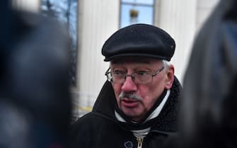 Oleg Orlov, a board member at Memorial, is seen outside the Moscow City Court where a hearing into prosecutor's request to dissolve Russia's rights group Memorial's Human Rights Center, which campaigns for the rights of political prisoners and other groups under pressure from authorities, over violations of the foreign agent legislation is due to take place in Moscow on December 23, 2021. (Photo by Vasily MAXIMOV / AFP) (Photo by VASILY MAXIMOV/AFP via Getty Images)