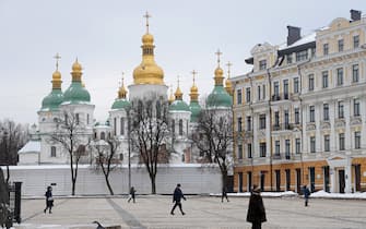 KYIV, UKRAINE - JANUARY 25: People walk past Saint Sophia Cathedral at Sophia Square on January 25, 2022 in Kyiv, Ukraine.  International fears of an imminent Russian military invasion of Ukraine remain high as Russian troops mass along the Russian-Ukrainian border.  (Photo by Sean Gallup / Getty Images)