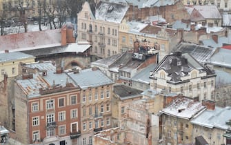 An old Trabant parked on the roof of a historic building House of Legends, in Lviv's city center, during a snow showers.On Sunday, January 14, 2018, in Lviv, Lviv Oblast, Ukraine. (Photo by Artur Widak/NurPhoto)