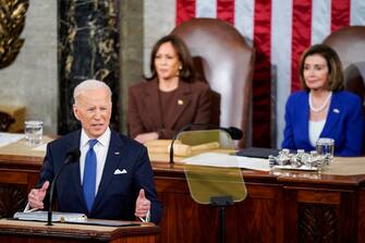 WASHINGTON, DC - MARCH 01: U.S. President Joe Biden delivers the State of the Union address flanked by Vice President Kamala Harris and House Speaker Nancy Pelosi (D-CA) during a joint session of Congress in the U.S. Capitolâ  s House Chamber on March 01, 2022 in Washington, DC. During his first State of the Union address, Biden spoke on his administrationâ  s efforts to lead a global response to the Russian invasion of Ukraine, efforts to curb inflation and bringing the country out of the COVID-19 pandemic. (Photo by Jabin Botsford-Pool/Getty Images)