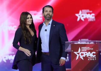 ORLANDO, FLORIDA - FEBRUARY 26: Don Trump, Jr. and Kimberly Guilfoyle stand on stage as they address the Conservative Political Action Conference being held in the Hyatt Regency on February 26, 2021 in Orlando, Florida. Begun in 1974, CPAC brings together conservative organizations, activists, and world leaders to discuss issues important to them. (Photo by Joe Raedle/Getty Images)