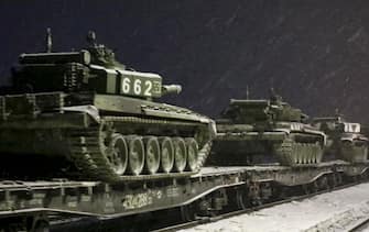epa09768542 A handout still image taken from a handout video made available by the Russian Defense Ministry press service shows Russian tanks being transported by rail from a ground shooting range in Russia, 18 February 2022. Units of the Western and Southern military districts on February 15 began returning from exercises to their bases by rail and road, the Russian Defense Ministry official said.  EPA / RUSSIAN DEFENSE MINISTRY PRESS SERVICE HANDOUT HANDOUT EDITORIAL USE ONLY / NO SALES