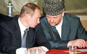 RUSSIA-CHECHNYA-PUTIN-KADYROV ITAR-TASS POOL
MOS01 - 20000706 - MOZDOK, NORTH OSSETIA, RUSSIAN FEDERATION : Russian President Vladimir Putin (L) talks to head of Chechnya's pro-Moscow administration Akhmad Kadyrov (R) during an emergency meeting with the top military and civilian officials in military base in Mozdok, North Ossetia, late night 05 July 2000. President Putin has berated his ministers over a wave of suicide bombings that killed dozens of Russian soldiers in Chechnya. EPA PHOTO POOL/ITAR-TASS/jt
