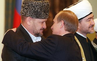 AP POOLMOS10 - 20000315 - MOSCOW, RUSSIAN FEDERATION :  (FILES) Photo dated 15 March 2000 of the then acting President Vladimir Putin (R) greeting Chechnya's top religious leader Mufti Akhmad Alidkhadzhi Kadyrov at the Kremlin. At R is Russia's Muslim leader Sheik Ravil Gainutdin. On Monday 12 June 2000 Mufti Kadyrov was named by the Kremlin as the Head of Administration of Chechnya. EPA PHOTO POOL/AP/IS