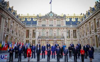 10 March 2022, France, Versailles: Emmanuel Macron (M), president of France, stands together for the family photo outside the Palace of Versailles at the start of the meeting with European Union EU leaders at an informal two-day meeting. The topic is the current development after the Russian attack on Ukraine. Photo: Kay Nietfeld/dpa (Photo by Kay Nietfeld/picture alliance via Getty Images)