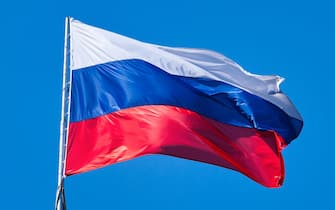 Russian flag waving atop of its pole.