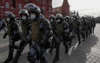 epa09805222 Russian policemen deploy prior to an unauthorized rally against the Russian special operation in Ukraine, in downtown Moscow, Russia, 06 March 2022. According to independent Russian human rights group OVD-Info, hundreds of people were arrested in protests throughout major Russian cities on 06 March.  EPA/YURI KOCHETKOV