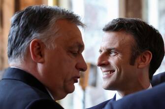 epa09816745 French President Emmanuel Macron (R) and Hungarian Prime Minister Viktor Orban attend an informal summit of EU leaders at the Chateau de Versailles (Versailles Palace) in Versailles, near Paris, France, 11 March 2022. EU heads of state and government met at the Versailles summit to discuss further sanctions against Russia for aggression against Ukraine, including sanctions on banks and individuals.  EPA/SARAH MEYSSONNIER / POOL  MAXPPP OUT