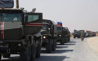 KAMISLI, SYRIA - SEPTEMBER 14: Russian military vehicles drive on the road as Russia makes a new military and logistic reinforcement of 30 vehicles to its military points in Kamisli, which is occupied by PKK, listed as a terrorist organization by Turkey, the US and the EU, and the Syrian Kurdish YPG militia, which Turkey regards as a terror group in Kamisli, Syria on September 14, 2020. (Photo by Samer Uveyd / Anadolu Agency via Getty Images)