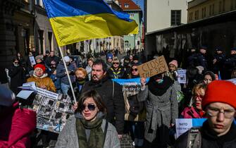 KRAKOW, POLAND - MARCH 13: Ukrainians, Belarusians and Poles hold banners and flags as they demand NATO enforce a no-fly zone in Ukraine during a protest in front of the US consulate on March 13, 2022 in Krakow, Poland. This morning, Russian missiles hit a military site in western Ukraine mere miles from the Polish border, bringing the war close to NATO's boundaries. Leaders of NATO countries have so far ruled out a "no fly zone" that would see them engaging with Russian aircraft. (Photo by Omar Marques/Getty Images)