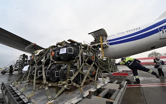 Employees unload a Boeing 747-412 plane with the FGM-148 Javelin, American man-portable anti-tank missile provided by US to Ukraine as part of a military support to Ukraine, at Kyiv's airport Boryspil on February 11,2022, amid the crisis linked with the threat of Russia's invasion. (Photo by Sergei SUPINSKY / AFP) (Photo by SERGEI SUPINSKY/AFP via Getty Images)