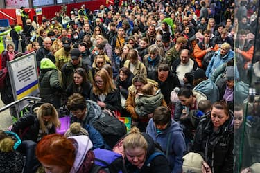 KRAKOW, POLAND - MARCH 15: People who fled the war in Ukraine walk towards a humanitarian train to relocate refugees to Berlin on March 15, 2022 in Krakow, Poland. More than half of the roughly 3 million Ukrainians fleeing war have crossed into neighbouring Poland since Russia began a large-scale armed invasion of Ukraine on February 24, 2022. (Photo by Omar Marques/Getty Images)