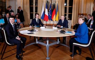 (From L) Ukrainian President Volodymyr Zelensky, French President Emmanuel Macron, Russian President Vladimir Putin and German Chancellor Angela Merkel attend a meeting on Ukraine at the Elysee Palace, on December 9, 2019 in Paris. - Russian president will for the first time hold formal talks with his Ukrainian counterpart over the conflict in Ukraine's east, at a much-anticipated summit in Paris. (Photo by Ian LANGSDON / POOL / AFP) (Photo by IAN LANGSDON/POOL/AFP via Getty Images)