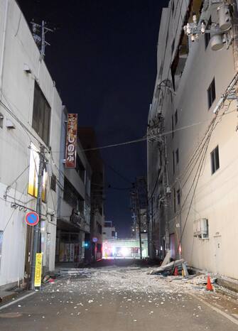 epa09829293 Parts of a building wall fell in a street in Fukushima, northeastern Japan, early 17 March 2022. 6.4-magnitude earthquake, shortly followed by a magnitude 7.3 earthquake hit northeastern Japan late 16 March provoking electricity shortage.  The Japan Meteorological Agency issued a tsunami alert in the Pacific coast of the area.  EPA / JIJI PRESS JAPAN OUT EDITORIAL USE ONLY / NO ARCHIVES