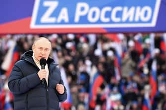 Russian President Vladimir Putin gives a speech at a concert marking the eighth anniversary of Russia's annexation of Crimea at the Luzhniki stadium in Moscow on March 18, 2022. (Photo by Sergei GUNEYEV / POOL / AFP) (Photo by SERGEI GUNEYEV/POOL/AFP via Getty Images)