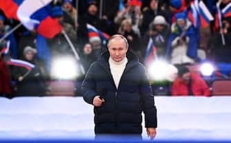 Russian President Vladimir Putin attends a concert marking the eighth anniversary of Russia's annexation of Crimea at the Luzhniki stadium in Moscow on March 18, 2022. (Photo by Sergei GUNEYEV / POOL / AFP) (Photo by SERGEI GUNEYEV / POOL / AFP via Getty Images )