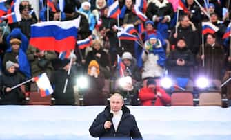 Russian President Vladimir Putin gives a speech at a concert marking the eighth anniversary of Russia's annexation of Crimea at the Luzhniki stadium in Moscow on March 18, 2022. (Photo by Sergei GUNEYEV / POOL / AFP) (Photo by SERGEI GUNEYEV / POOL / AFP via Getty Images)