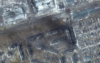 RUSSIANS INVADE UKRAINE - MARCH 12, 2022: 04 Maxar multispectral close up satellite view of apartment buildings and fire, western Mariopol, Ukraine.  12march2022_wv2.  Please use: Satellite image (c) 2022 Maxar Technologies.