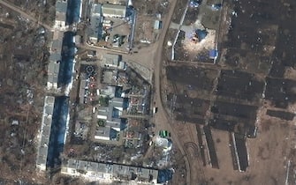 RUSSIANS INVADE UKRAINE -- MARCH 14, 2022:  04 Maxar satellite imagery of apartment buildings and church AFTER invasion in Sumy, Ukraine.  14march2022_ge1.  Please use: Satellite image (c) 2022 Maxar Technologies.  Before/after comparison of damaged residential apartment buildings and nearby church (Location: 47.617, 37.497)
