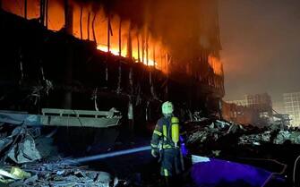 KYIV, UKRAINE - MARCH 21: (----EDITORIAL USE ONLY â MANDATORY CREDIT - "STATE EMERGENCY SERVICE OF UKRAINE / HANDOUT" - NO MARKETING NO ADVERTISING CAMPAIGNS - DISTRIBUTED AS A SERVICE TO CLIENTS----)  Firefigters extinguish fire broke out after a Russian shelling of a shopping mall in the Podilskyi district of Kyiv, Ukraine on March 21, 2022. At least 4 people were killed in the Russian attack on shopping mall, State Emergency Services of Ukraine reported. (Photo by State Emergency Services of Ukraine/Handout/Anadolu Agency via Getty Images)