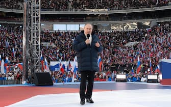epa09834416 Russian President Vladimir Putin attends a concert marking the 8th anniversary of Crimea's reunification with Russia at the Luzhniki stadium in Moscow, Russia, 18 March 2022. Russia in 2014 annexed the Black Sea peninsula, shortly after Crimeans voted in a disputed referendum to secede from Ukraine.  EPA/RAMIL SITDIKOV / SPUTNIK POOL