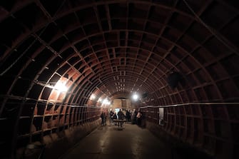 epa09159124 Visitors attend the nuclear defense Bunker 703, at a depth of 43 meters, in Moscow, Russia, 25 April 2021. The recently declassified facility of Cold War period, the bunker was in use by the ministry of Foreign Affairs until 2005. On 2018 was converted into the museum the Bunker 703.  EPA/MAXIM SHIPENKOV  ATTENTION: This Image is part of a PHOTO SET