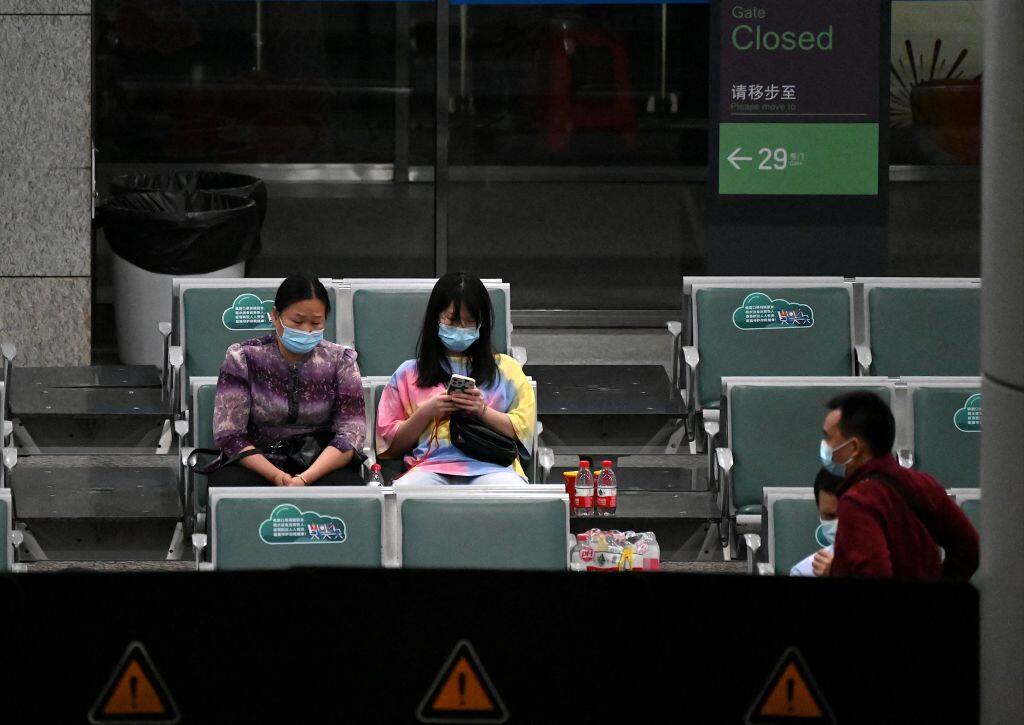 Relatives of passengers on China Eastern flight MU5375 are seen at the holding area, after the plane failed to arrive at Guangzhou Baiyun International Airport in China's southern Guangdong province on March 22, 2022. - Airline China Eastern said that there had been fatalities after one of its passenger jets carrying 132 people crashed in southern China on Monday, with the cause of the crash "still under investigation". (Photo by Noel Celis / AFP) (Photo by NOEL CELIS/AFP via Getty Images)