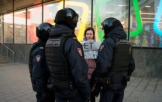 Anti war protester holding a sign about to be detained, in Moscow, Russia, on February 28, 2022 during a demonstration against the war on Ukraine.  (Photo by Daniil Danchenko/NurPhoto via Getty Images)
