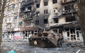 A destroyed BTR armoured vehicle likely belonging to Azov Battalion defenders lies next to a destroyed apartment complex in the besieged Ukrainian city. The battle between Russian / Pro Russian forces and the defencing Ukrainian forces lead by Azov battalion continues in the port city of Mariupol. (Photo by Maximilian Clarke / SOPA Images/Sipa USA)