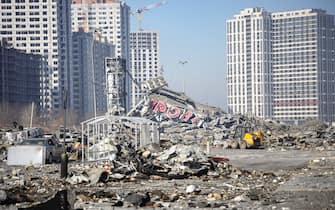KYIV, UKRAINE - MARCH 23, 2022 - A shopping mall lies in ruins after a missile strike of the Russian troops in the Podilskyi district of Kyiv, capital of Ukraine.