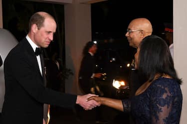 Prince William (L) is greeted by The Governor General of Jamaica Patrick Allen and his wife Lady Allen (R) as he arrives for a state dinner at Kings House in Kingston, Jamaica, March 23, 2022. - The Duke and Duchess of Cambridge arrived in Jamaica on March 22, 2022 for a series of outings in honor of Queen Elizabeth's Platinum Jubilee year. (Photo by Ricardo Makyn / AFP) (Photo by RICARDO MAKYN/AFP via Getty Images)