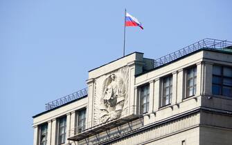 Russian flag on top of the State Duma of Russian Federation Building, Moscow