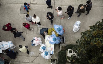 Residents line up to receive rapid antigen test kits for Covid-19 at a neighborhood in Shanghai, China, on Saturday, March 26, 2022. China’s economy faces its worst downward pressure since the spring of 2020 when it was hit by the first wave of Covid-19, according to Nomura Holdings Inc. Photographer: Qilai Shen/Bloomberg