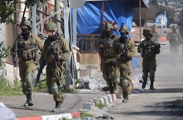 JENIN, WEST BANK - MARCH 30: Israeli army forces raid the home of the Palestinian, who fatally shot five Israelis in the city of Bnei Brak, near Tel Aviv, in Ya'bad town of Jenin, West Bank on March 30, 2022. (Photo by Nedal Eshtayah/Anadolu Agency via Getty Images)