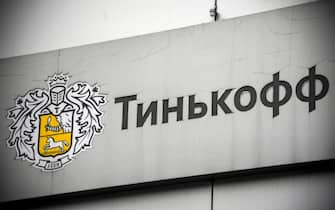 The logo of the Tinkoff Bank is pictured at their head office in Moscow on March 6, 2020. - The shares of the Russian private Tinkoff Bank, a pioneer of online banking technology, collapsed on the stock market on March 6, 2020, after Oleg Tinkov the president and founder of the TCS Group, the parent company of Tinkoff Bank, was charged with filing false tax returns, according to the U.S. Department of Justice. (Photo by Alexander NEMENOV / AFP) (Photo by ALEXANDER NEMENOV/AFP via Getty Images)