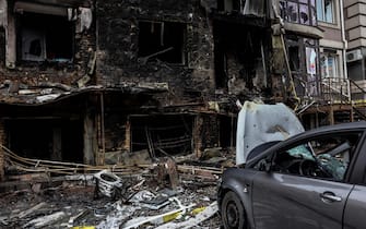 A destroyed building is pictured in Bucha, northwest of Kyiv, on April 2, 2022, where town's mayor said 280 people had been buried in a mass grave and that the town is littered with corpses.  - Ukraine has regained control of 