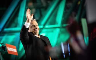 epa09868950 A handout photo made available by the Hungarian PM's Press Office shows Hungarian Prime Minister Viktor Orban waves to his supporters during the governing Fidesz-KDNP party's event after the general election and national referendum on the child protection law in Budapest, Hungary, 03 April 2022.  EPA/ZOLTAN FISCHER / HUNGARIN PRIME MNISTER OFFICE / HANDOUT  HANDOUT EDITORIAL USE ONLY/NO SALES