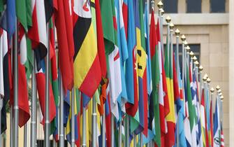 81490846 GENEVA - JUNE 08: Numerous national flags are seen in front of the United Nations Office (UNOG) on June 8, 2008 in Geneva, Switzerland. Housed at the Palais des Nations, the United Nations Office at Geneva serves as the representative office of the Secretary-General at Geneva. A focal point for multilateral diplomacy, UNOG services more than 8,000 meetings every year, making it one of the busiest conference centres in the world. With more than 1,600 staff, it is the biggest duty stations outside of United Nations headquarters in New York. (Photo by Johannes Simon/Getty Images)