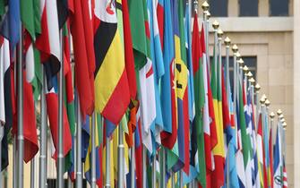 GENEVA - JUNE 08:  Numerous national flags are seen in front of the United Nations Office (UNOG) on June 8, 2008 in Geneva, Switzerland. Housed at the Palais des Nations, the United Nations Office at Geneva serves as the representative office of the Secretary-General at Geneva. A focal point for multilateral diplomacy, UNOG services more than 8,000 meetings every year, making it one of the busiest conference centres in the world. With more than 1,600 staff, it is the biggest duty stations outside of United Nations headquarters in New York.  (Photo by Johannes Simon/Getty Images)